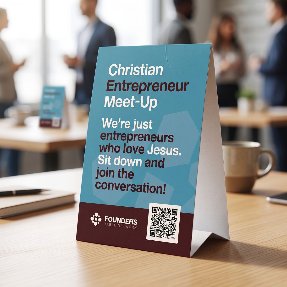 A Founder's Table table tent card on a coffee shop table